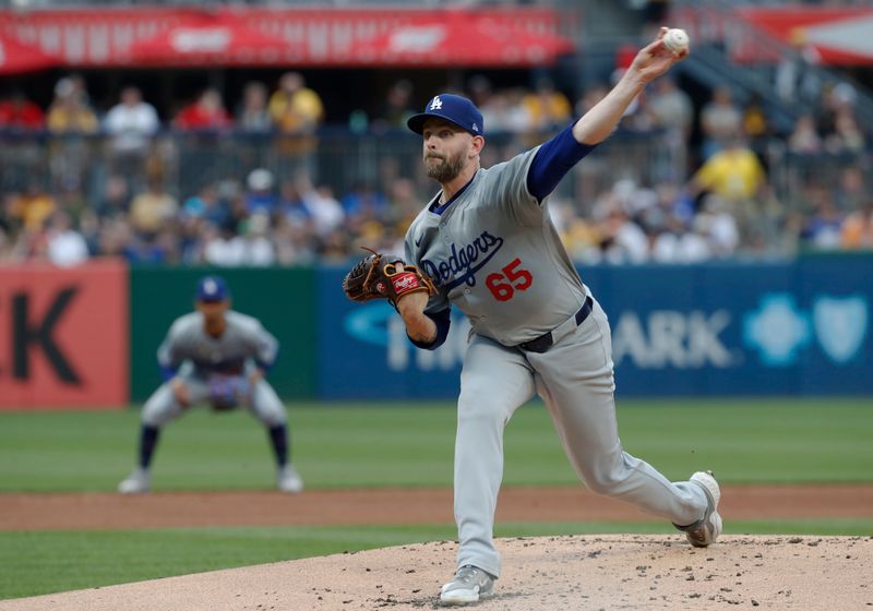 Jun 5, 2024; Pittsburgh, Pennsylvania, USA;  Los Angeles Dodgers starting pitcher James Paxton (65) delivers a pitch against the Pittsburgh Pirates during the first inning at PNC Park. Mandatory Credit: Charles LeClaire-USA TODAY Sports