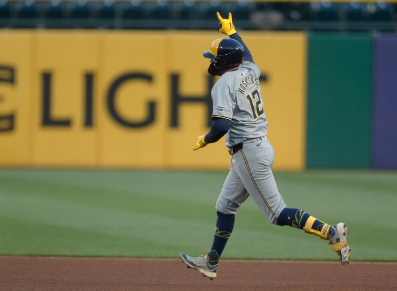 Apr 22, 2024; Pittsburgh, Pennsylvania, USA;  Milwaukee Brewers designated hitter Rhys Hoskins (12) circles the bases on a solo home run against the Pittsburgh Pirates during the fifth inning at PNC Park. Mandatory Credit: Charles LeClaire-USA TODAY Sports