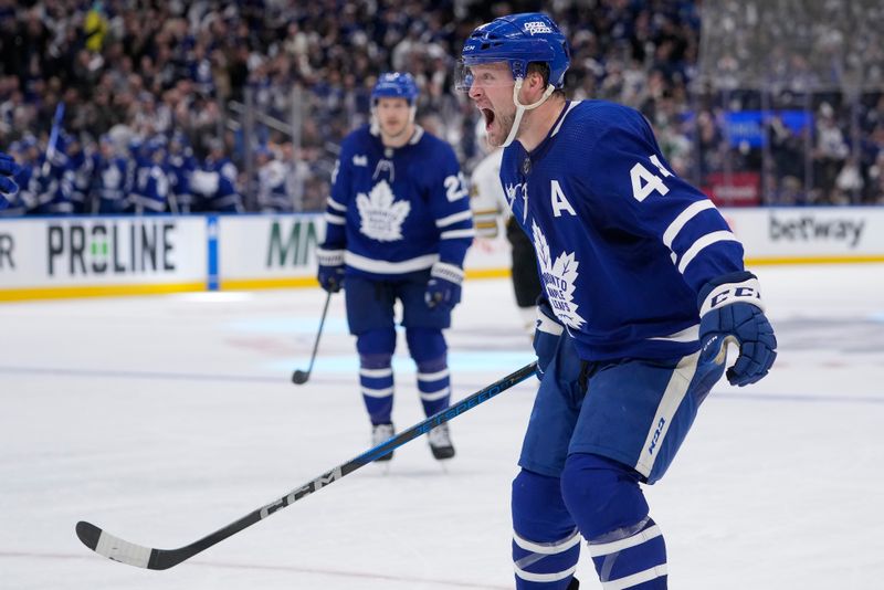 Apr 24, 2024; Toronto, Ontario, CAN; Toronto Maple Leafs defenseman Morgan Rielly (44) reacts after assisting on a goal by forward Tyler Bertuzzi (not pictured) during the third period against the Boston Bruins in game three of the first round of the 2024 Stanley Cup Playoffs at Scotiabank Arena. Mandatory Credit: John E. Sokolowski-USA TODAY Sports