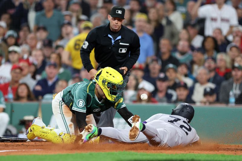 Sep 12, 2025; Boston, Massachusetts, USA; New York Yankees shortstop Jose Caballero (72) slides past Boston Red Sox catcher Carlos Narvaez (75) during the seventh inning at Fenway Park. Mandatory Credit: Paul Rutherford-Imagn Images