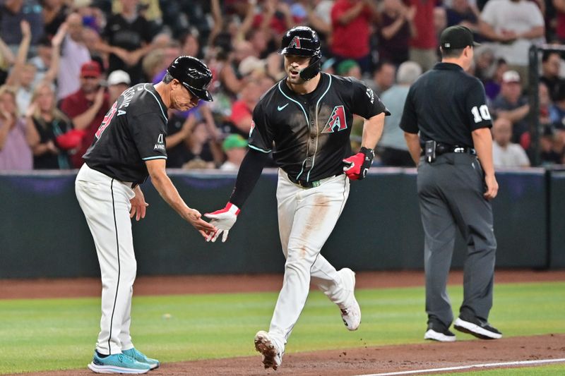 Aug 29, 2024; Phoenix, Arizona, USA;  Arizona Diamondbacks outfielder Randal Grichuk (15) celebrates with third base coach Tony Perezchica (21) after hitting a two run home run in the third inning against the New York Mets at Chase Field. Mandatory Credit: Matt Kartozian-USA TODAY Sports