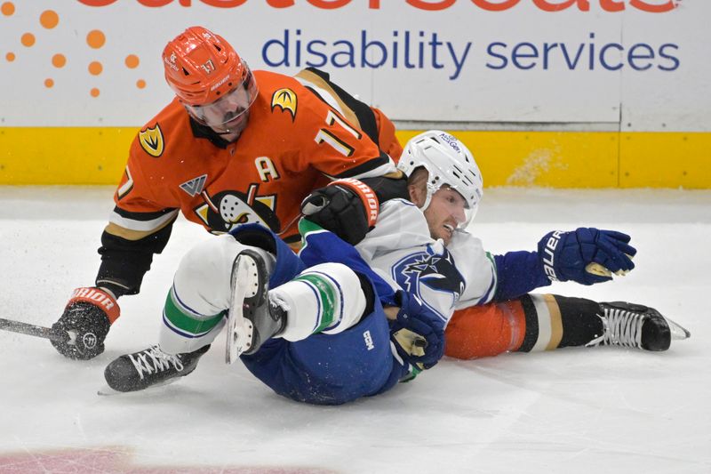 Nov 5, 2024; Anaheim, California, USA;  Vancouver Canucks defenseman Erik Brannstrom (26) and Anaheim Ducks left wing Alex Killorn (17) battle on the ice in the second period at Honda Center. Mandatory Credit: Jayne Kamin-Oncea-Imagn Images