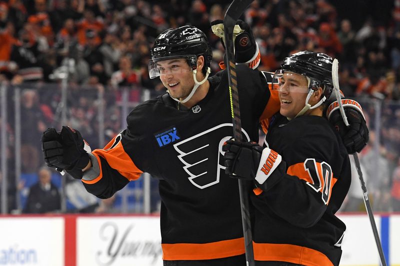 Feb 25, 2025; Philadelphia, Pennsylvania, USA; Philadelphia Flyers right wing Tyson Foerster (71) celebrates his goal with right wing Bobby Brink (10) against the Pittsburgh Penguins during the second period at Wells Fargo Center. Mandatory Credit: Eric Hartline-Imagn Images