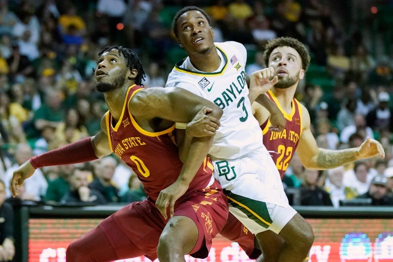 Mar 4, 2023; Waco, Texas, USA; Iowa State Cyclones forward Tre King (0) boxes out  Baylor Bears guard Dale Bonner (3) on a free throw during the second half at Ferrell Center. Mandatory Credit: Raymond Carlin III-USA TODAY Sports