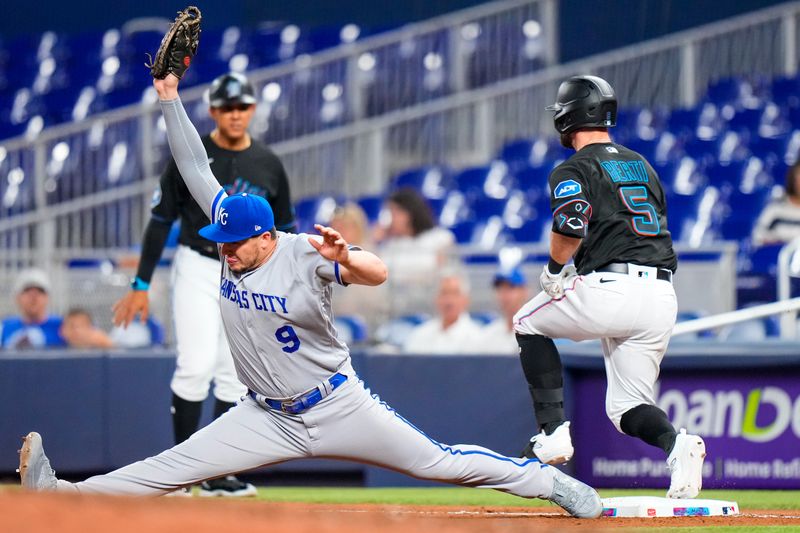 Jun 7, 2023; Miami, Florida, USA; Kansas City Royals first baseman Vinnie Pasquantino (9) tags out Miami Marlins shortstop Jon Berti (5) during the seventh inning at loanDepot Park. Mandatory Credit: Rich Storry-USA TODAY Sports