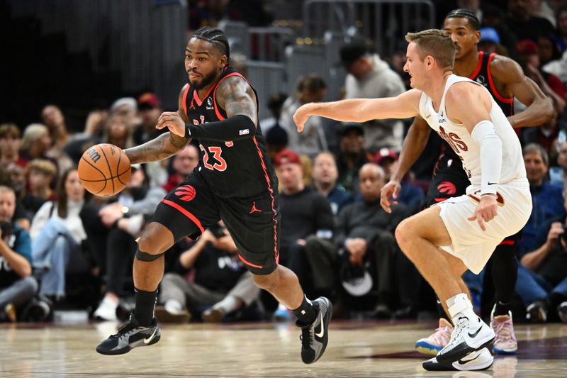 CLEVELAND, OHIO - NOVEMBER 24: Jamal Shead #23 of the Toronto Raptors brings the ball up court around Sam Merrill #5 of the Cleveland Cavaliers during the fourth quarter at Rocket Mortgage Fieldhouse on November 24, 2024 in Cleveland, Ohio. The Cavaliers defeated the Raptors 122-108.NOTE TO USER: User expressly acknowledges and agrees that, by downloading and or using this photograph, User is consenting to the terms and conditions of the Getty Images License Agreement. (Photo by Jason Miller/Getty Images)