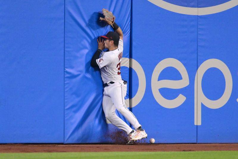 May 26, 2023; Cleveland, Ohio, USA; Cleveland Guardians left fielder Steven Kwan (38) hits the wall while trying to catch an RBI double hit by St. Louis Cardinals center fielder Lars Nootbaar (not pictured) during the ninth inning at Progressive Field. Mandatory Credit: Ken Blaze-USA TODAY Sports