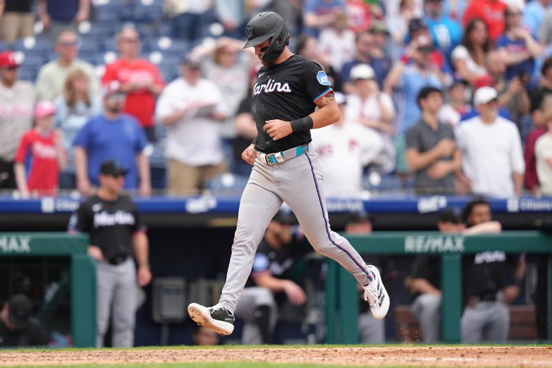 Apr 19, 2025; Philadelphia, Pennsylvania, USA; Miami Marlins infielder Connor Norby (1) advances home to score against the Philadelphia Phillies in the ninth inning at Citizens Bank Park. Mandatory Credit: Kyle Ross-Imagn Images