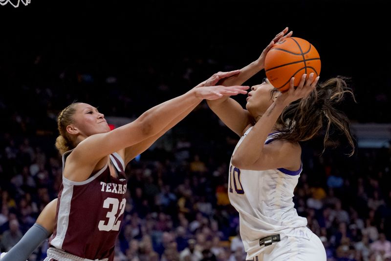 Jan 11, 2024; Baton Rouge, Louisiana, USA; LSU Lady Tigers forward Angel Reese (10) looks to shoot around Texas A&M Aggies forward Lauren Ware (32) during the second half at Pete Maravich Assembly Center. Mandatory Credit: Matthew Hinton-USA TODAY Sports