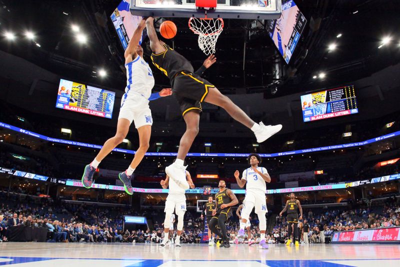 Jan 19, 2023; Memphis, Tennessee, USA; Memphis Tigers forward Kaodirichi Akobundu-Ehiogu (5) blocks the shot of Wichita State Shockers guard Jaron Pierre Jr. (5) during the first half at FedExForum. Mandatory Credit: Petre Thomas-USA TODAY Sports