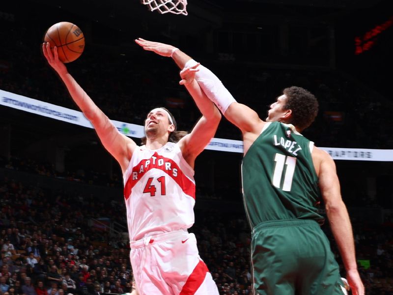 TORONTO, CANADA - JANUARY 6: Kelly Olynyk #41 of the Toronto Raptors drives to the basket during the game against the Milwaukee Bucks on January 6, 2025 at the Scotiabank Arena in Toronto, Ontario, Canada.  NOTE TO USER: User expressly acknowledges and agrees that, by downloading and or using this Photograph, user is consenting to the terms and conditions of the Getty Images License Agreement.  Mandatory Copyright Notice: Copyright 2025 NBAE (Photo by Vaughn Ridley/NBAE via Getty Images)