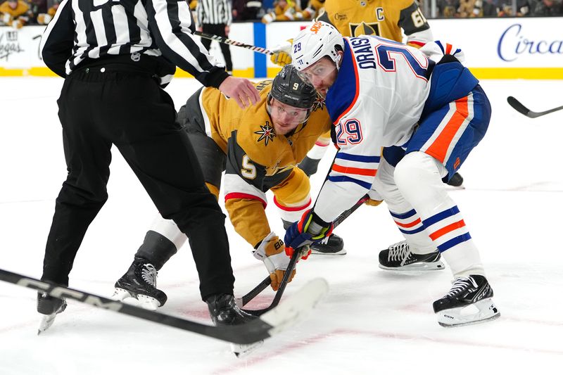 Apr 1, 2025; Las Vegas, Nevada, USA; Vegas Golden Knights center Jack Eichel (9) and Edmonton Oilers center Leon Draisaitl (29) watch the puck after a face-off during the second period at T-Mobile Arena. Mandatory Credit: Stephen R. Sylvanie-Imagn Images
