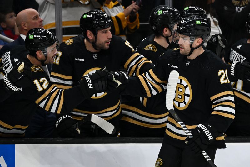 Oct 14, 2023; Boston, Massachusetts, USA; Boston Bruins left wing James van Riemsdyk (21) high-fives defenseman Kevin Shattenkirk (12) after scoring a goal against the Nashville Predators during the third period at the TD Garden. Mandatory Credit: Brian Fluharty-USA TODAY Sports