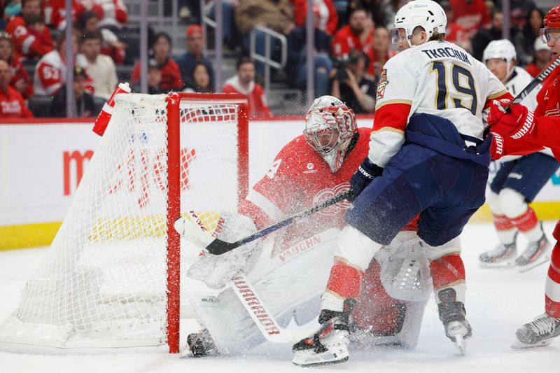 Mar 2, 2024; Detroit, Michigan, USA; Detroit Red Wings goaltender Alex Lyon (34) makes a save on Florida Panthers left wing Matthew Tkachuk (19) in the first period at Little Caesars Arena. Mandatory Credit: Rick Osentoski-USA TODAY Sports