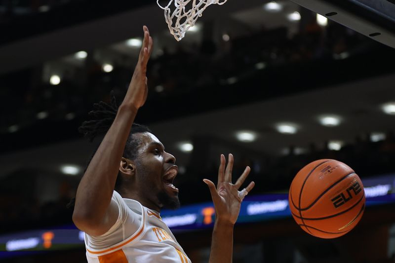 Jan 6, 2024; Knoxville, Tennessee, USA; Tennessee Volunteers forward Jonas Aidoo (0) dunks the ball against the Mississippi Rebels during the first half at Thompson-Boling Arena at Food City Center. Mandatory Credit: Randy Sartin-USA TODAY Sports