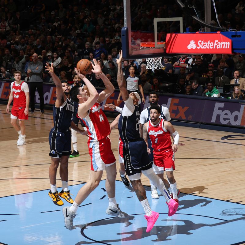 MEMPHIS, TN - JANUARY 6:  Zach Edey #14 of the Memphis Grizzlies drives to the basket during the game against the Dallas Mavericks  on January  6, 2024 at FedExForum in Memphis, Tennessee. NOTE TO USER: User expressly acknowledges and agrees that, by downloading and or using this photograph, User is consenting to the terms and conditions of the Getty Images License Agreement. Mandatory Copyright Notice: Copyright 2024 NBAE (Photo by Joe Murphy/NBAE via Getty Images)