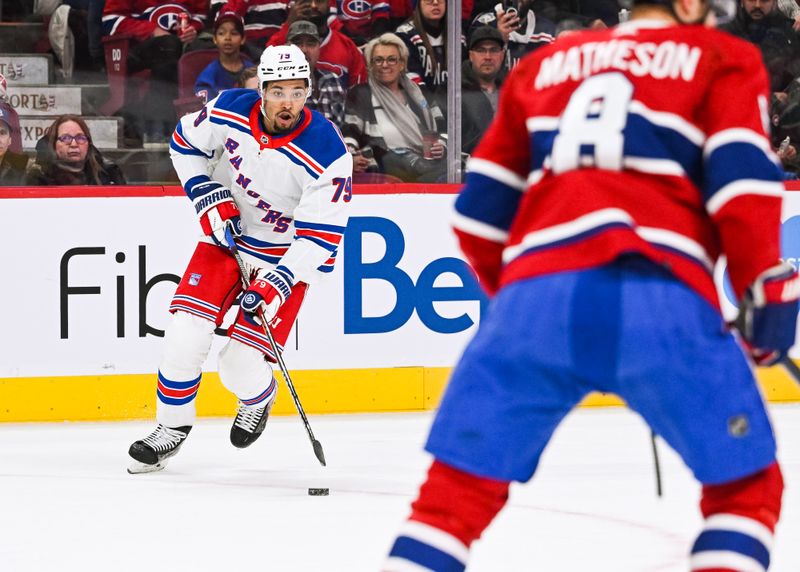 Mar 9, 2023; Montreal, Quebec, CAN; New York Rangers defenseman K'Andre Miller (79) plays the puck against the Montreal Canadiens during the first period at Bell Centre. Mandatory Credit: David Kirouac-USA TODAY Sports