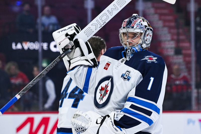 Dec 3, 2025; Montreal, Quebec, CAN; Winnipeg Jets goalie Eric Comrie (1) during warm-up before a game against the Montreal Canadiens at Bell Centre. Mandatory Credit: David Kirouac-Imagn Images