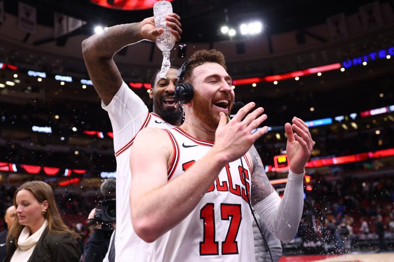 CHICAGO, ILLINOIS - FEBRUARY 28: Onuralp Bitim #17 of the Chicago Bulls gets a water celebration from Andre Drummond #3 after the game against the Cleveland Cavaliers at the United Center on February 28, 2024 in Chicago, Illinois. NOTE TO USER: User expressly acknowledges and agrees that, by downloading and or using this photograph, User is consenting to the terms and conditions of the Getty Images License Agreement. (Photo by Michael Reaves/Getty Images)