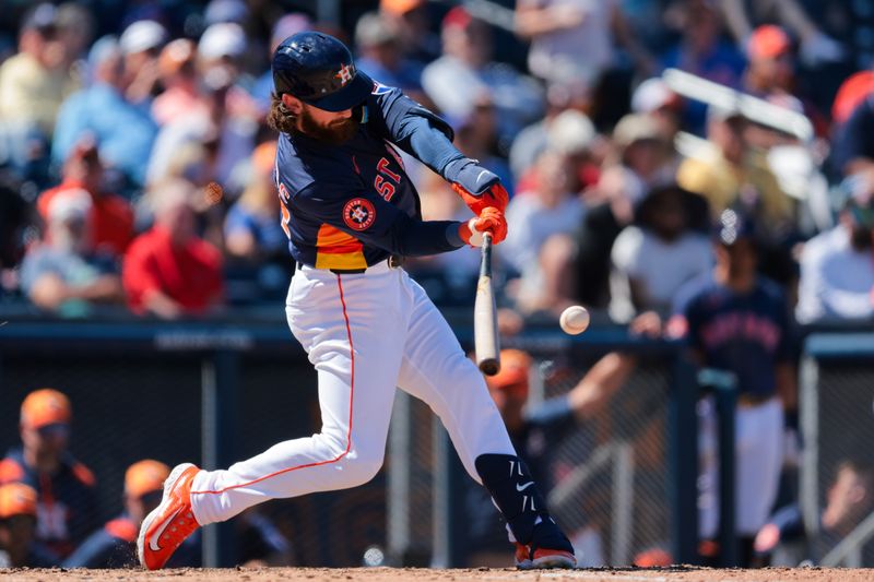 Mar 11, 2025; West Palm Beach, Florida, USA; Houston Astros second baseman Brendan Rodgers (54) hits a ground rule double against the New York Mets during the seventh inning at CACTI Park of the Palm Beaches. Mandatory Credit: Sam Navarro-Imagn Images