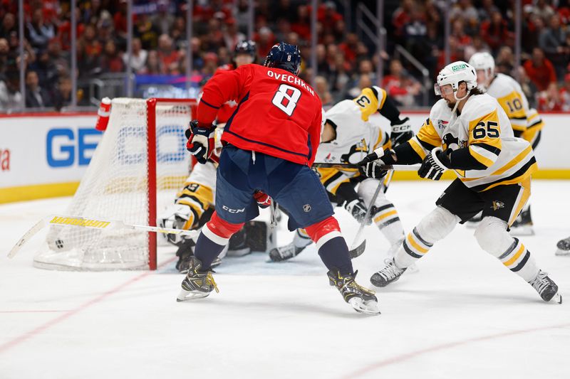 Apr 4, 2024; Washington, District of Columbia, USA; Washington Capitals left wing Alex Ovechkin (8) scores a goal on Pittsburgh Penguins goaltender Alex Nedeljkovic (39) in the third period at Capital One Arena. Mandatory Credit: Geoff Burke-USA TODAY Sports