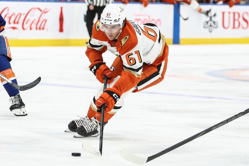 Oct 29, 2024; Elmont, New York, USA; Anaheim Ducks left wing Cutter Gauthier (61) controls the puck in the first period against the New York Islanders at UBS Arena. Mandatory Credit: Wendell Cruz-Imagn Images