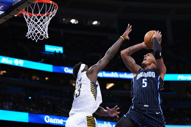 ORLANDO, FLORIDA - OCTOBER 28: Paolo Banchero #5 of the Orlando Magic goes up for a shot against Pascal Siakam #43 of the Indiana Pacers during the first quarter at Kia Center on October 28, 2024 in Orlando, Florida. NOTE TO USER: User expressly acknowledges and agrees that, by downloading and or using this photograph, User is consenting to the terms and conditions of the Getty Images License Agreement. (Photo by Rich Storry/Getty Images)