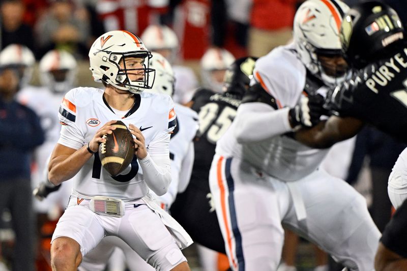 Nov 9, 2023; Louisville, Kentucky, USA; Virginia Cavaliers quarterback Anthony Colandrea (10) looks to pass against the Louisville Cardinals during the first half at L&N Federal Credit Union Stadium. Louisville defeated Virginia 31-24. Mandatory Credit: Jamie Rhodes-USA TODAY Sports