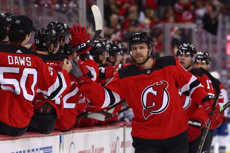 Feb 6, 2024; Newark, New Jersey, USA; New Jersey Devils center Chris Tierney (11) celebrates his goal against the Colorado Avalanche during the first period at Prudential Center. Mandatory Credit: Ed Mulholland-USA TODAY Sports