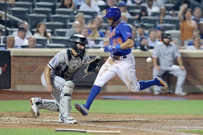 Jul 18, 2023; New York City, New York, USA; New York Mets left fielder Tommy Pham (28) scores a run against Chicago White Sox catcher Seby Zavala (44) on a single by Mets second baseman Jeff McNeil (not pictured) during the sixth inning at Citi Field. Mandatory Credit: Brad Penner-USA TODAY Sports