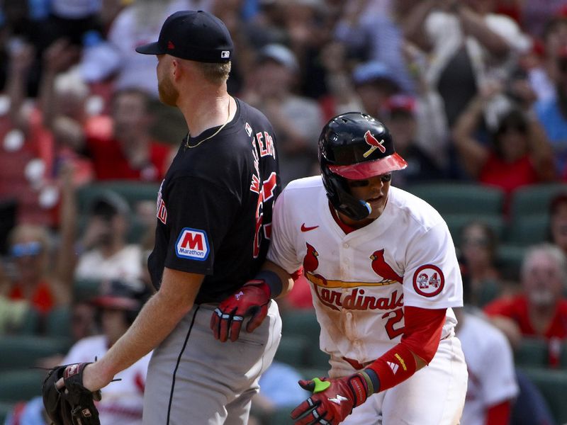 Sep 22, 2024; St. Louis, Missouri, USA;  St. Louis Cardinals center fielder Lars Nootbaar (21) scores on a wild pitch by Cleveland Guardians relief pitcher Andrew Walters (63) during the seventh inning at Busch Stadium. Mandatory Credit: Jeff Curry-Imagn Images