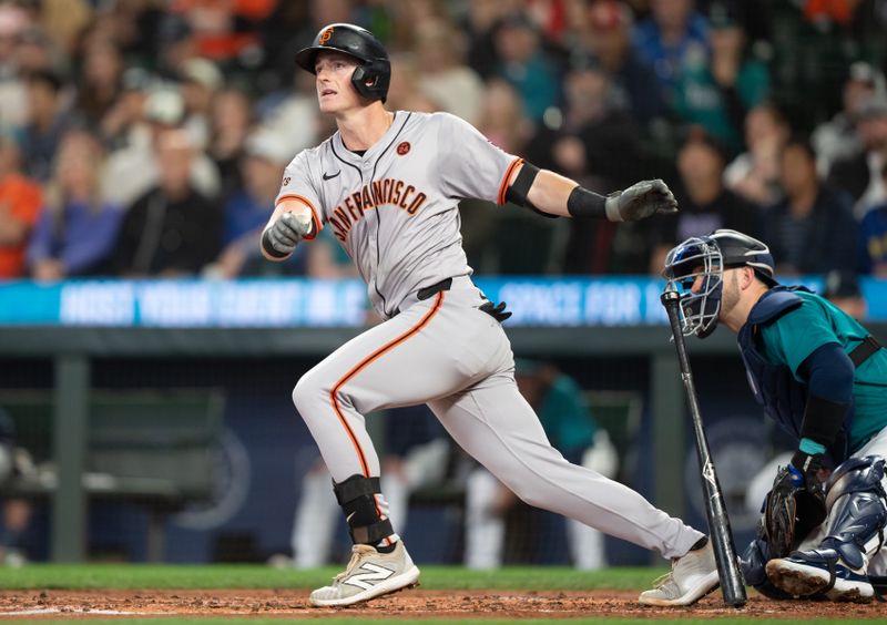 Aug 23, 2024; Seattle, Washington, USA; San Francisco Giants shortstop Tyler Fitzgerald (49) hits a RBI-single during the second inning against the Seattle Mariners at T-Mobile Park. Mandatory Credit: Stephen Brashear-USA TODAY Sports