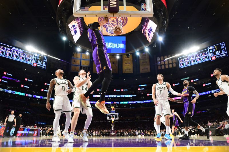 LOS ANGELES, CA - MARCH 8: Anthony Davis #3 of the Los Angeles Lakers dunks the ball during the game against the Milwaukee Bucks on March 8, 2024 at Crypto.Com Arena in Los Angeles, California. NOTE TO USER: User expressly acknowledges and agrees that, by downloading and/or using this Photograph, user is consenting to the terms and conditions of the Getty Images License Agreement. Mandatory Copyright Notice: Copyright 2024 NBAE (Photo by Adam Pantozzi/NBAE via Getty Images)