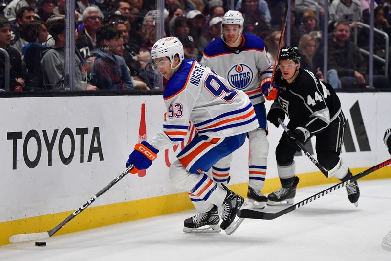 Dec 30, 2023; Los Angeles, California, USA; Edmonton Oilers center Ryan Nugent-Hopkins (93) moves the pick against the Los Angeles Kings during the third period at Crypto.com Arena. Mandatory Credit: Gary A. Vasquez-USA TODAY Sports