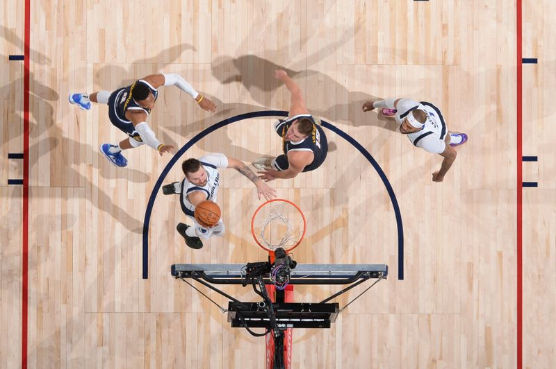 DENVER, CO - NOVEMBER 10:  Luka Doncic #77 of the Dallas Mavericks shoots the ball during the game against the Denver Nuggets during a regular season game on November 10, 2024 at Ball Arena in Denver, Colorado. NOTE TO USER: User expressly acknowledges and agrees that, by downloading and/or using this Photograph, user is consenting to the terms and conditions of the Getty Images License Agreement. Mandatory Copyright Notice: Copyright 2024 NBAE (Photo by Bart Young/NBAE via Getty Images)