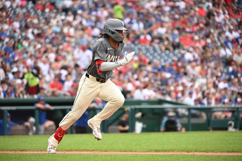 Aug 31, 2024; Washington, District of Columbia, USA; Washington Nationals shortstop Jose Tena (8) sprints to first base after a base hit against the Chicago Cubs during the second inning at Nationals Park. Mandatory Credit: Rafael Suanes-USA TODAY Sports