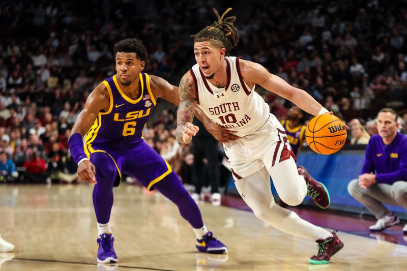 Feb 17, 2024; Columbia, South Carolina, USA; South Carolina Gamecocks guard Myles Stute (10) drives past LSU Tigers guard Jordan Wright (6) in the first half at Colonial Life Arena. Mandatory Credit: Jeff Blake-USA TODAY Sports