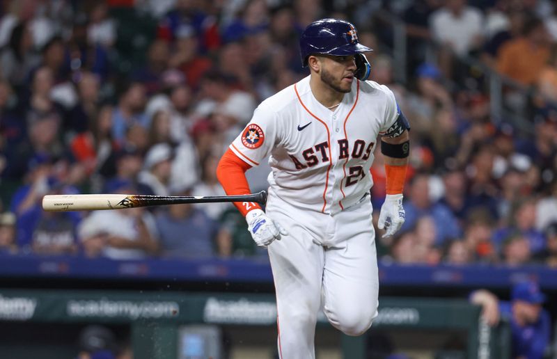 May 17, 2023; Houston, Texas, USA; Houston Astros catcher Yainer Diaz (21) hits a single during the seventh inning against the Chicago Cubs at Minute Maid Park. Mandatory Credit: Troy Taormina-USA TODAY Sports