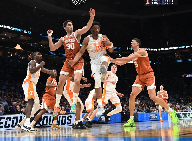 March 23, 2024, Charlotte, NC, USA; Tennessee Volunteers forward Tobe Awaka (11) rebounds the ball against Texas Longhorns forward Brock Cunningham (30) in the second round of the 2024 NCAA Tournament at the Spectrum Center. Mandatory Credit: Bob Donnan-USA TODAY Sports