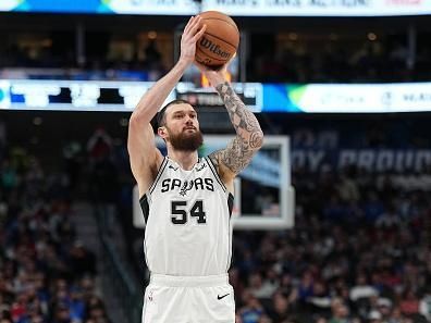 DALLAS, TX - DECEMBER 23: Sandro Mamukelashvili #54 of the San Antonio Spurs shoots a three point basket during the game against the Dallas Mavericks on December 23, 2023 at the American Airlines Center in Dallas, Texas. NOTE TO USER: User expressly acknowledges and agrees that, by downloading and or using this photograph, User is consenting to the terms and conditions of the Getty Images License Agreement. Mandatory Copyright Notice: Copyright 2023 NBAE (Photo by Glenn James/NBAE via Getty Images)