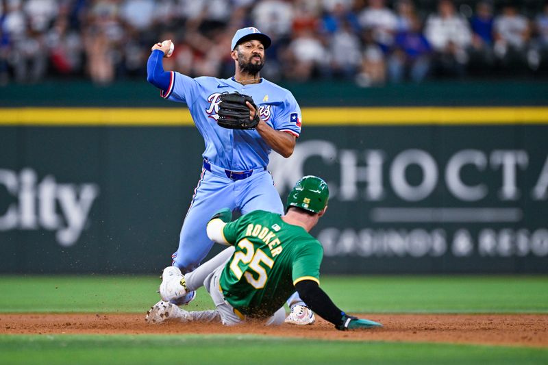 Sep 1, 2024; Arlington, Texas, USA; Texas Rangers second baseman Marcus Semien (2) puts out Oakland Athletics designated hitter Brent Rooker (25) at second base in a double play to end the ninth inning at Globe Life Field. Mandatory Credit: Jerome Miron-USA TODAY Sports