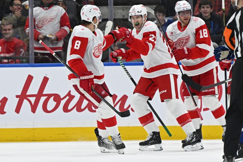 Oct 13, 2025; Toronto, Ontario, CAN; Detroit Red Wings left wing James van Riemsdyk (21) celebrates a goal with defenceman Ben Chiarot (8) and center Andrew Copp (18) in the third period against the Toronto Maple Leafs at Scotiabank Arena. Mandatory Credit: Gerry Angus-Imagn Images