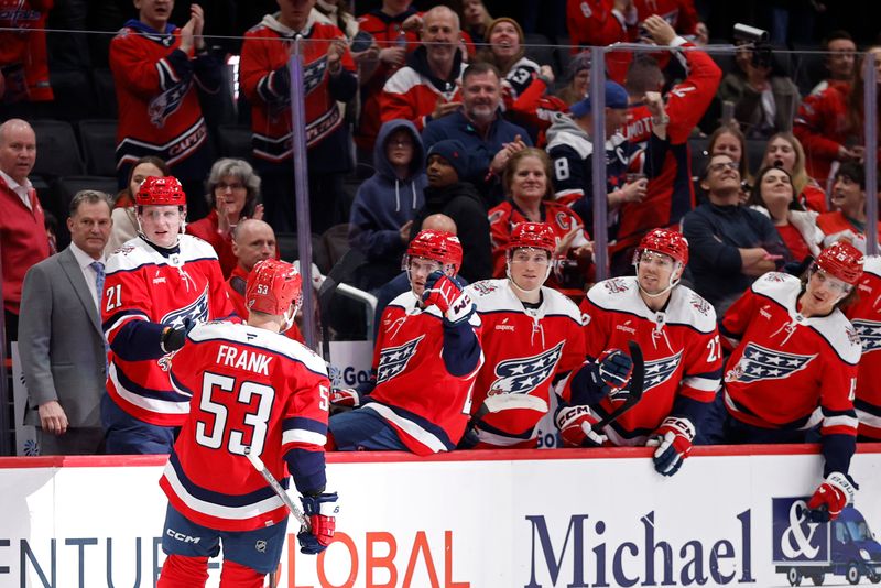 Jan 13, 2026; Washington, District of Columbia, USA; Washington Capitals center Ethen Frank (53) celebrates with teammates after scoring a goal against the Montréal Canadiens during the third period at Capital One Arena. Mandatory Credit: Geoff Burke-Imagn Images