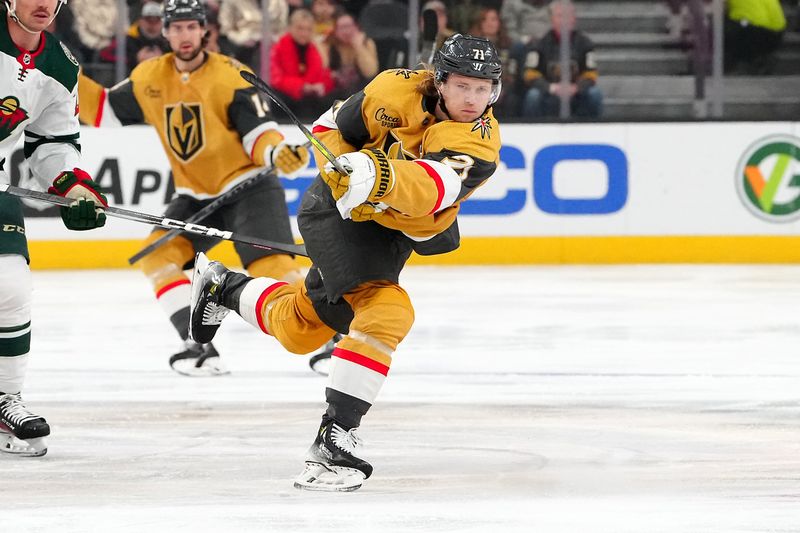 Feb 12, 2024; Las Vegas, Nevada, USA; Vegas Golden Knights center William Karlsson (71) shoots the puck into the Minnesota Wild zone during the first period at T-Mobile Arena. Mandatory Credit: Stephen R. Sylvanie-USA TODAY Sports