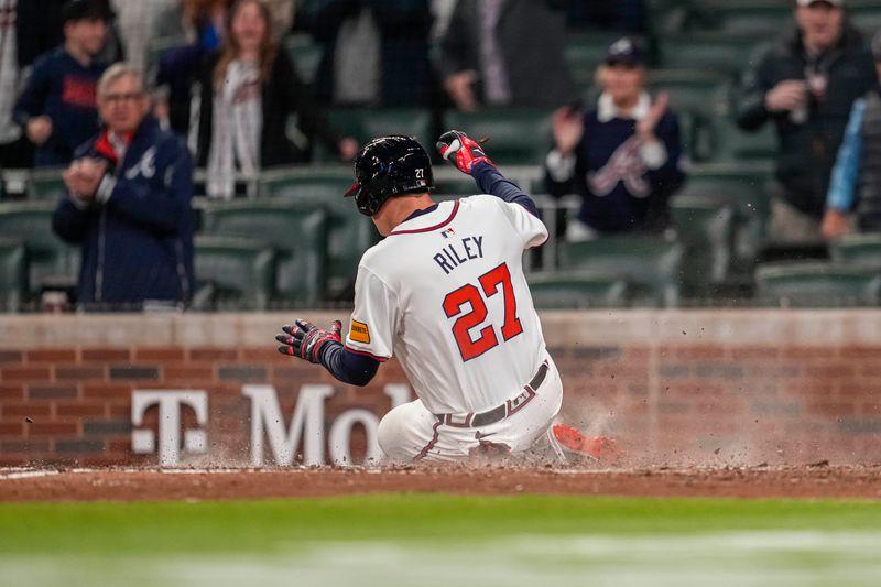 Apr 5, 2024; Cumberland, Georgia, USA; Atlanta Braves third base Austin Riley (27) scores a run against the Arizona Diamondbacks during the ninth inning at Truist Park. Mandatory Credit: Dale Zanine-USA TODAY Sports