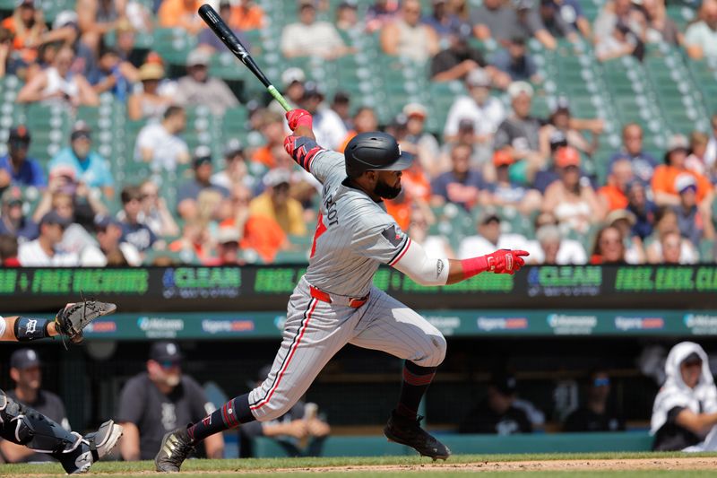 Jul 28, 2024; Detroit, Michigan, USA;  Minnesota Twins right fielder Manuel Margot (13) hits a double in the sixth inning against the Detroit Tigersat Comerica Park. Mandatory Credit: Rick Osentoski-USA TODAY Sports