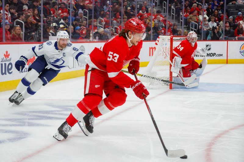 Jan 21, 2024; Detroit, Michigan, USA; Detroit Red Wings defenseman Moritz Seider (53) handles the puck during the first period at Little Caesars Arena. Mandatory Credit: Brian Bradshaw Sevald-USA TODAY Sports