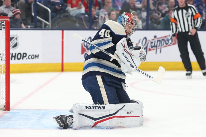 Mar 15, 2025; Columbus, Ohio, USA;  Columbus Blue Jackets goaltender Daniil Tarasov (40) saves the puck with during the first period against the New York Rangers at Nationwide Arena. Mandatory Credit: Joseph Maiorana-Imagn Images