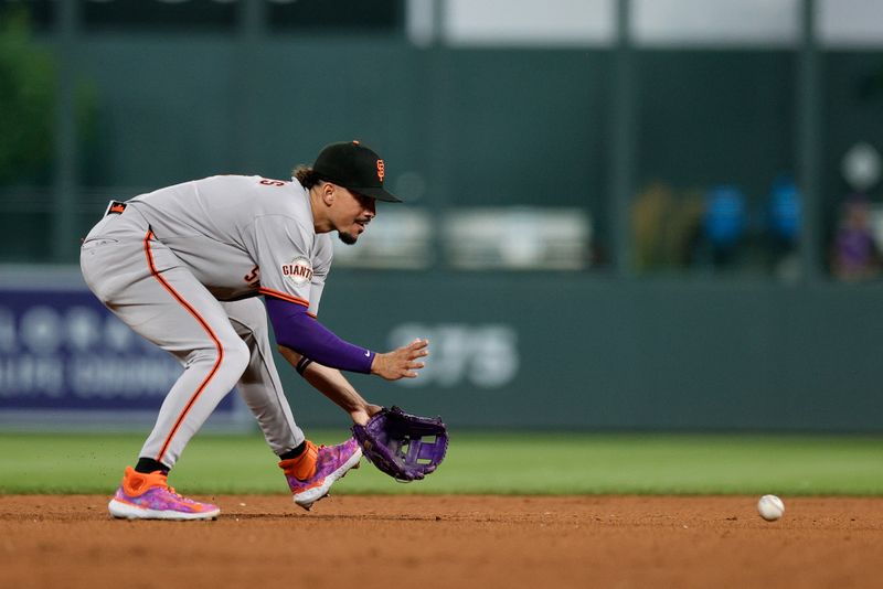 Sep 3, 2025; Denver, Colorado, USA; San Francisco Giants shortstop Willy Adames (2) fields the ball in the sixth inning against the Colorado Rockies at Coors Field. Mandatory Credit: Isaiah J. Downing-Imagn Images