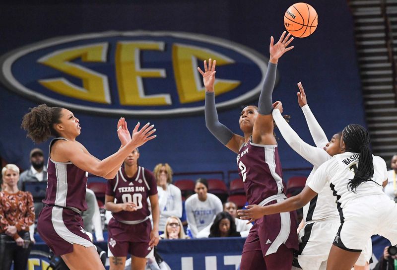 Mar 1, 2023; Greenville, SC, USA; Texas A&M forward Janiah Barker (2) tips a ball near Vanderbilt guard Demi Washington (12) , right, and Texas A&M forward Aaliyah Patty (32), left, during the fourth quarter of the SEC Women's Basketball Tournament at Bon Secours Wellness Arena. Mandatory Credit: Ken Ruinard-USA TODAY Sports